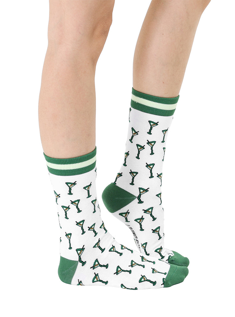 White and green women’s bamboo crew socks featuring a “Tini Time” cocktail-themed print, shown worn on a person against a white background.