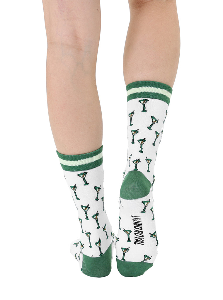 White and green women’s bamboo crew socks featuring a “Tini Time” cocktail-themed print, shown worn on a person against a white background.