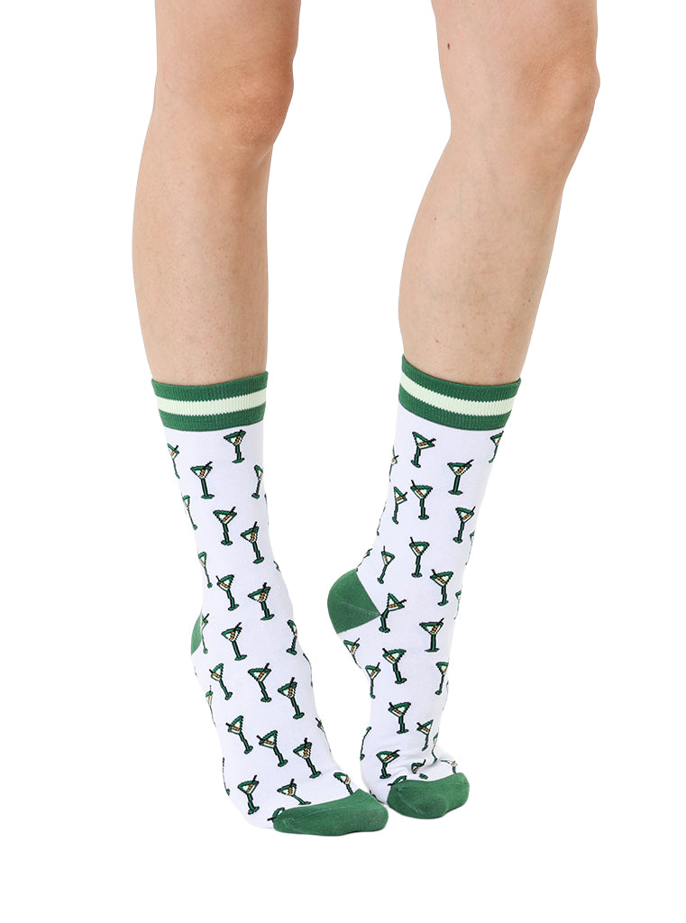 White and green women’s bamboo crew socks featuring a “Tini Time” cocktail-themed print, shown worn on a person against a white background.